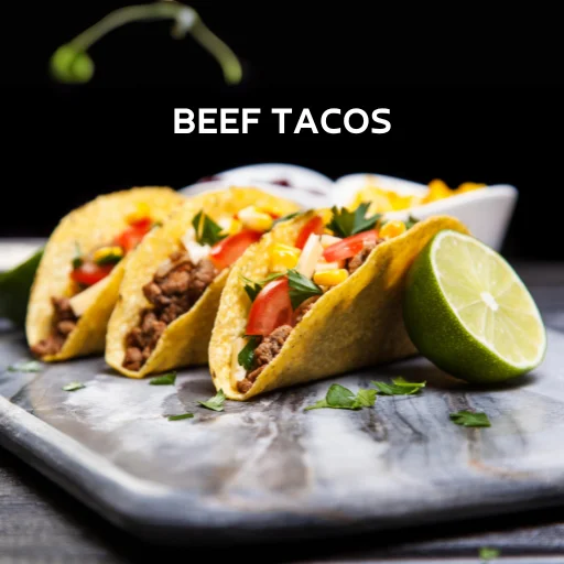 Ground Beef Taco Recipe with meat and vegetables on a cutting board