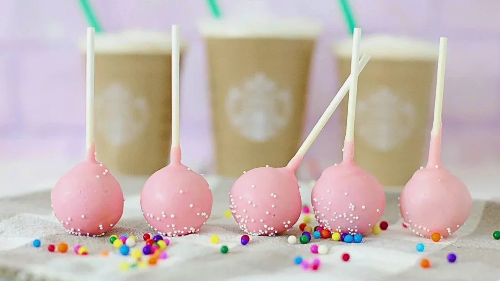 Beautifully packaged Starbucks Birthday Cake Pops recipe in clear gift boxes, tied with ribbons, perfect for gifting.