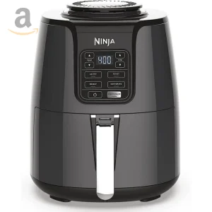 A Ninja Air Fryer on a kitchen countertop, with a digital display and a basket of crispy food.
